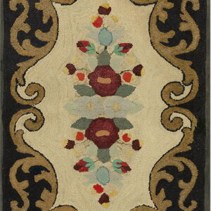 Ornate hooked rug with a cream center panel, dark border, and detailed red and blue floral bouquets.