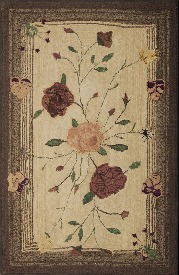 Cream floral hooked rug with large roses and green leaves, framed by textured dark brown and striped borders.