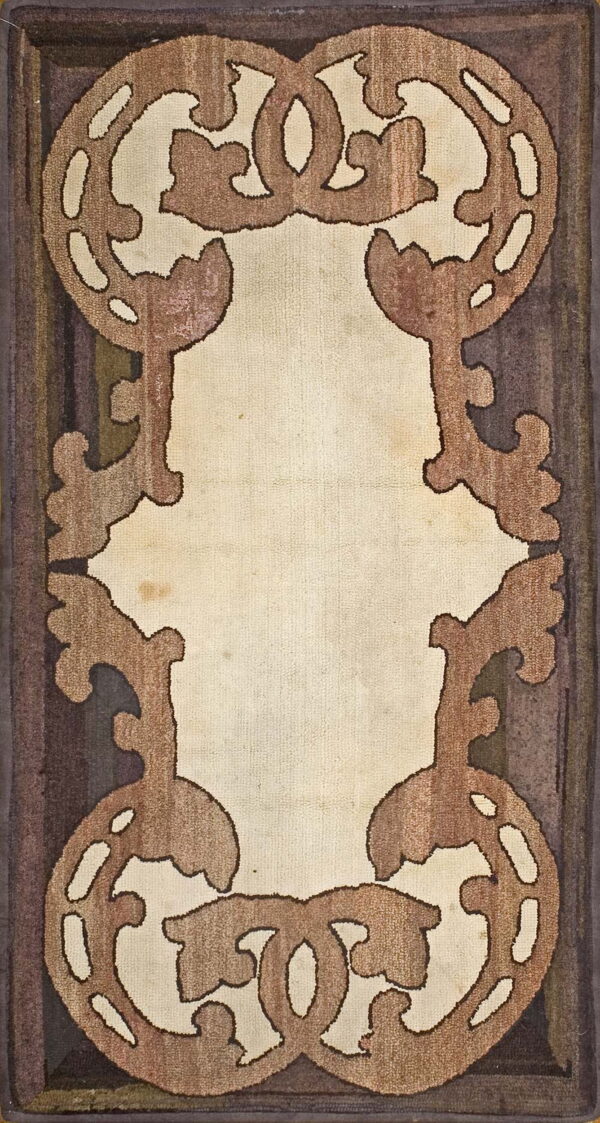 A brown and cream rug features large, stylized scrolled keyhole motifs framing a light central field.