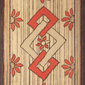 Chunky textured rug with a striped beige ground, coral flowers, and an interlocking red and tan diamond motif.