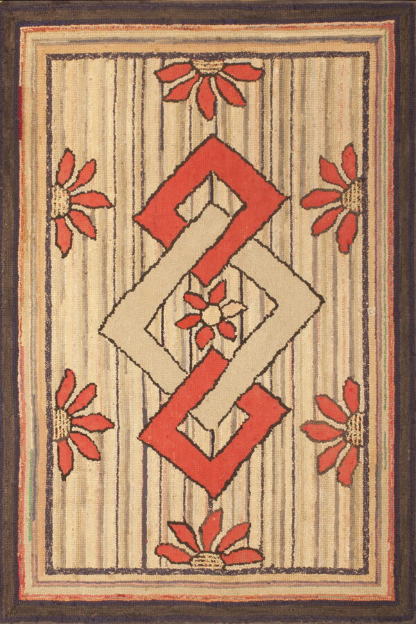 Chunky textured rug with a striped beige ground, coral flowers, and an interlocking red and tan diamond motif.