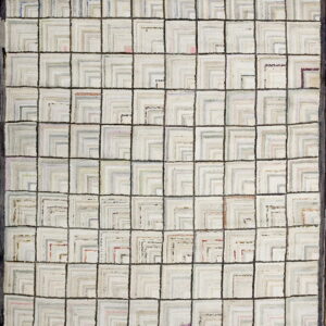 Chunky textured rug featuring a dark gray grid over squares filled with nested light gray geometric shapes.