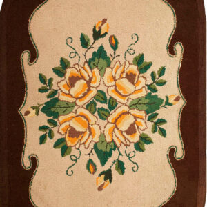 Floral design on oval hooked rug