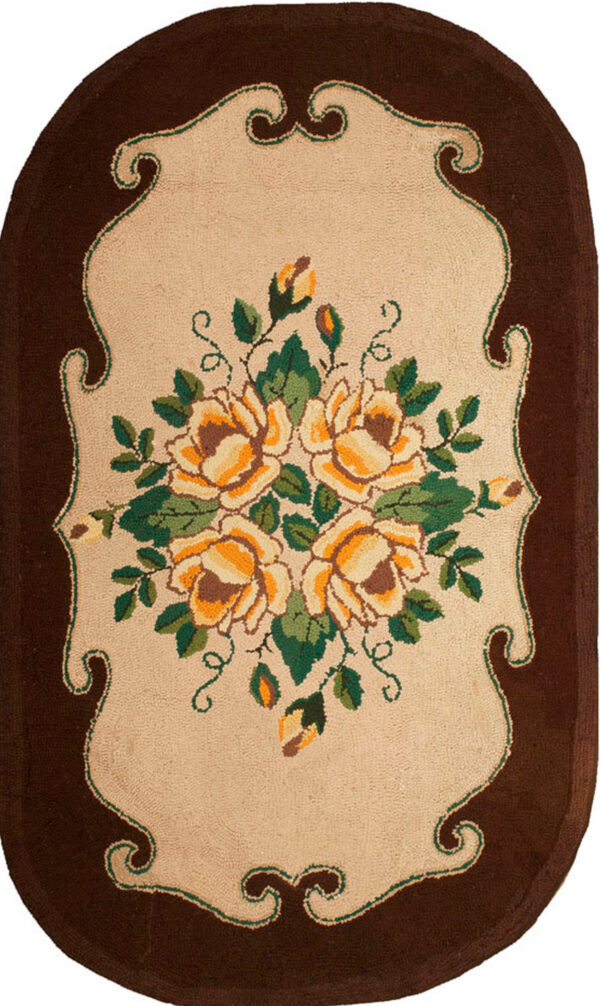 Floral design on oval hooked rug