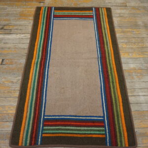 Runner rug with a solid tan field framed by vibrant vertical and horizontal multicolored stripes on wood flooring.