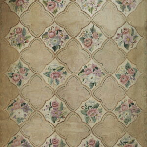 Tan area rug with a latticework pattern separating pale pink, purple, and cream floral clusters.