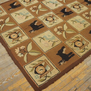 Block-patterned rug in browns and creams featuring black animal silhouettes and light floral designs on wood plank flooring.