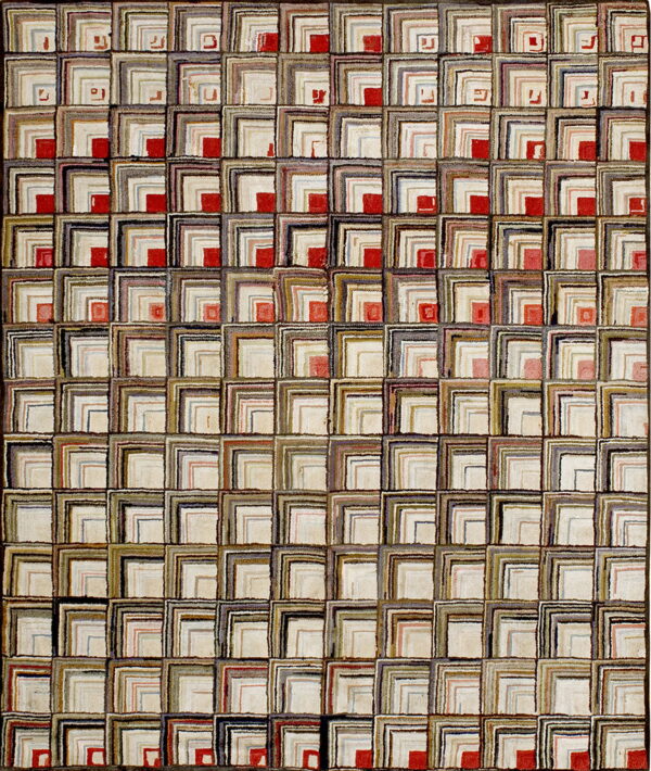 Textured rug with a grid pattern of nested l-shapes in mixed neutrals and scattered red accents.