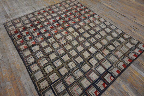 Textured rug featuring multicolored concentric squares over distressed gray and brown wooden planks.