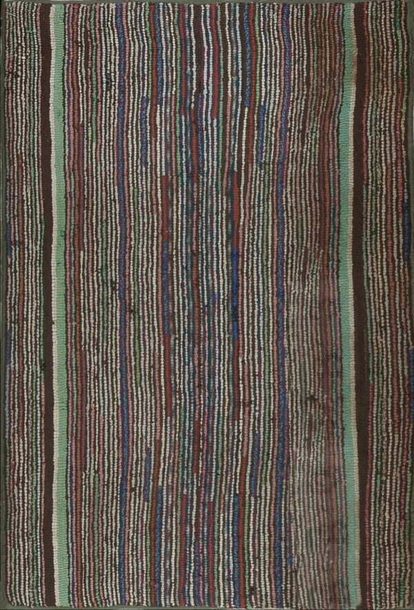 Shaggy rug displaying multicolored vertical striping in shades of dark brown, mint green, red, blue, and cream.