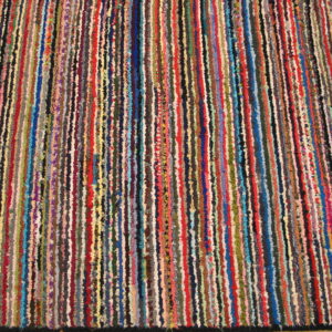 Textured rug displaying narrow vertical stripes in many colors, including red, blue, yellow, and green.