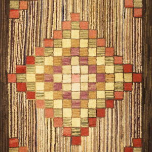 Textured rug featuring a central diamond of multicolored squares against a vertically striped field and dark border.