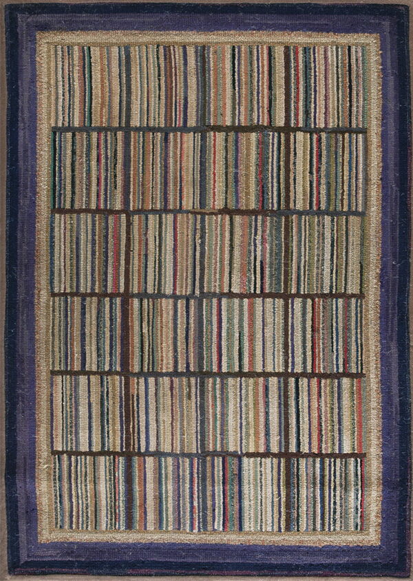 Textured rug featuring multicolored vertical stripes in segmented blocks, framed by beige and a wide navy border.