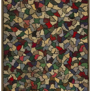 A hooked rug displays an irregular mosaic pattern in shades of red, green, beige, and blue with a brown border.