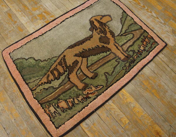 Textured area rug showing a brown dog scene in green and gray, bordered by salmon pink on wood floor.