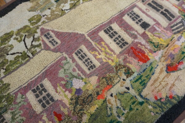 High-pile scenic rug featuring a maroon house, green trees, and a spotted white animal.