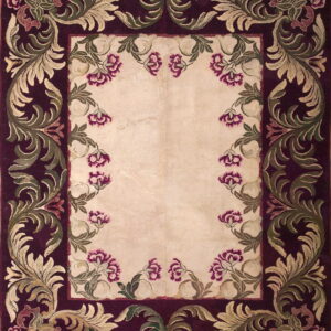 Burgundy and cream rug with a decorative border of green scrolling leaves and magenta floral accents.