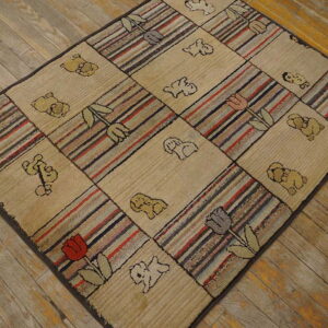 Checkerboard rug featuring beige animal designs and multi-color striped blocks, lying on worn wooden floorboards.