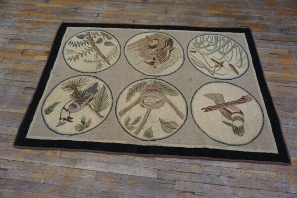 Beige hooked rug featuring six pictorial medallions of birds and nature, framed by a dark border on rustic wood floors.