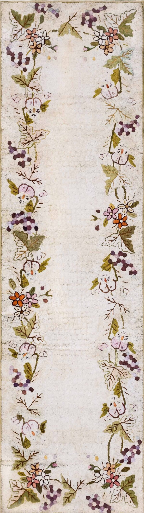 Cream textured runner bordered by winding vines, green leaves, pink flowers, and purple grape clusters.