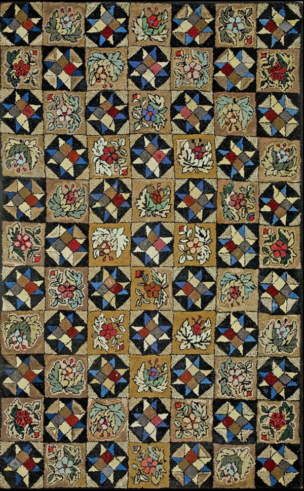 Multicolored hooked rug displaying a checkerboard of geometric star patterns and stylized earthy floral blocks.
