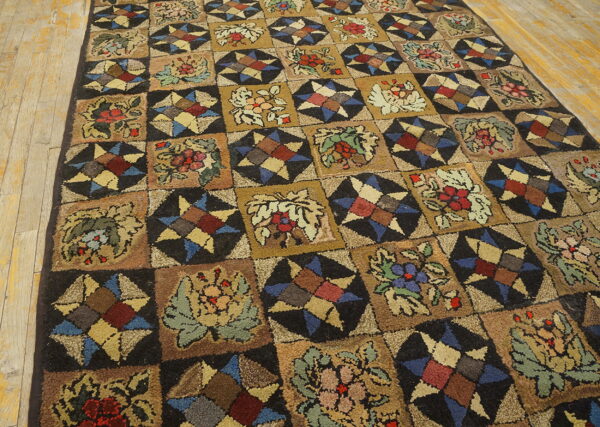 Earthy-toned rug with alternating botanical and geometric star patterns on light brown wooden floors.