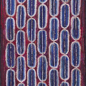 Deeply textured blue and white vertical capsule shapes repeat densely across a maroon and dark red runner rug.
