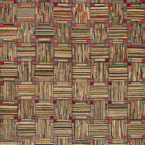 Close-up of a high-texture rug with a checkerboard pattern of multicolored stripes and squares.