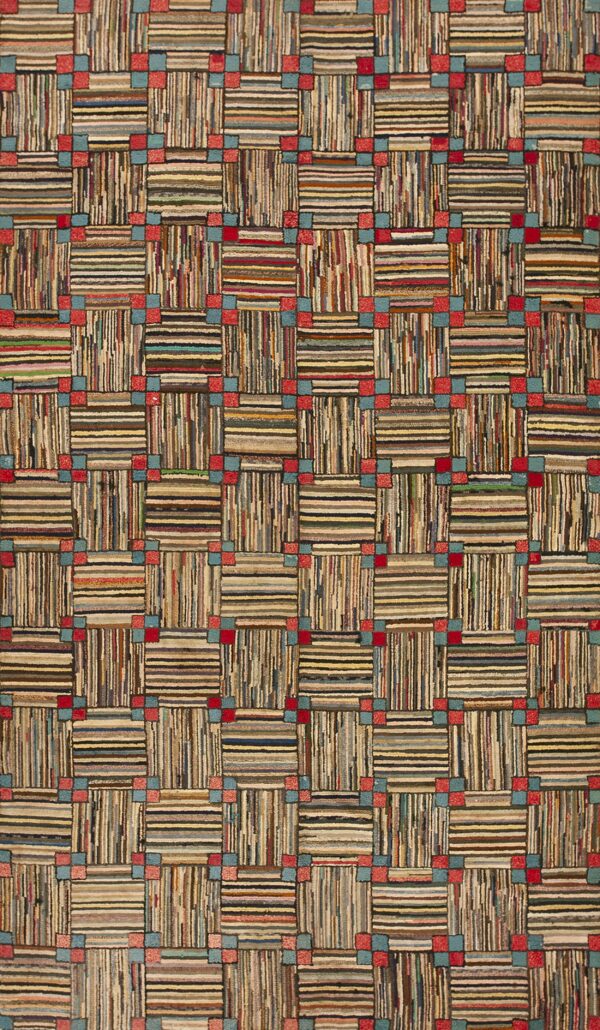 Close-up of a high-texture rug with a checkerboard pattern of multicolored stripes and squares.