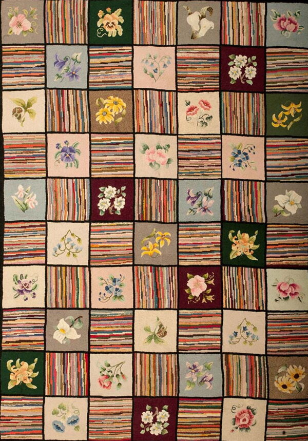 Multicolored patchwork rug with squares featuring floral motifs and contrasting multicolored striped sections.