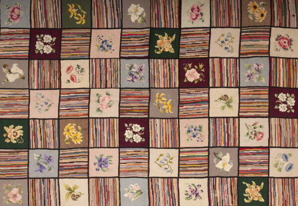 Checkerboard rug pattern with alternating squares of multicolored stripes and floral designs on solid backgrounds.