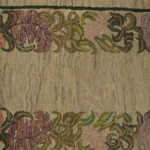 Photographed on a distressed wooden floor, this low-pile beige runner rug is framed by delicate purple and pink floral borders.