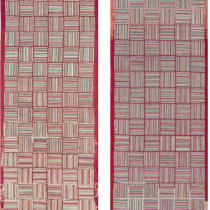 A runner rug with colorful striped squares forming a checkerboard pattern lies on light brown wood flooring.