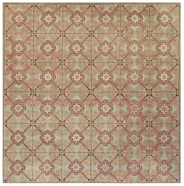 Square rug with a tile-like pattern in sage green, pale pink, and deep reddish-brown.