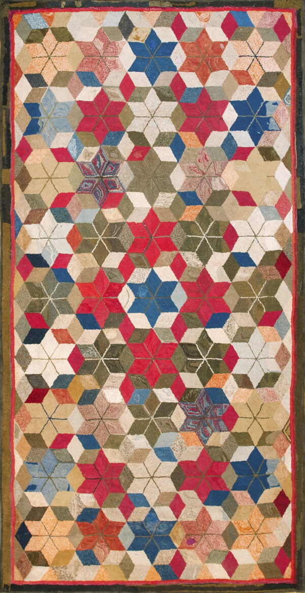 Multicolor textured rug with a dense geometric pattern of three-dimensional cubes and repeating six-pointed stars.