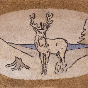 Oval hooked rug depicts a beige stag and pine trees framed by a textured brown border.