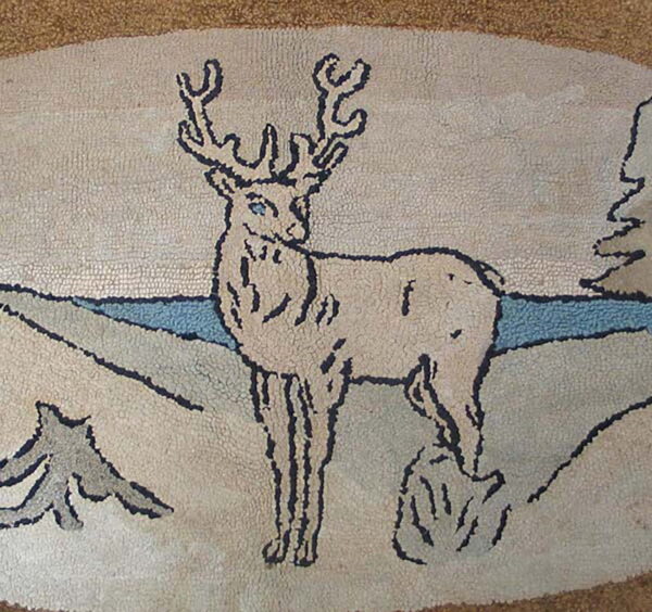 Detail of a hooked rug featuring a deer outlined in dark brown against a beige and blue landscape.