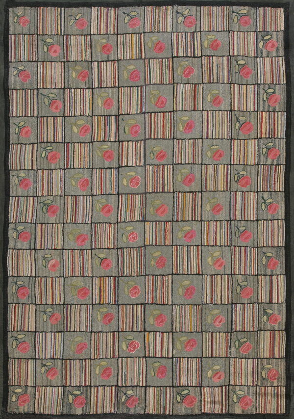 Textured rug displaying a checkerboard pattern of multicolored vertical stripes and pink roses on gray squares.