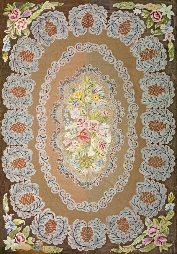 Tan and brown floral rug with a vibrant central bouquet and repeating blue and rust leafy motifs.