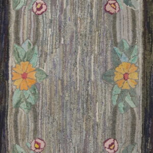 Hooked textile featuring a variegated gray center field framed by colorful rose and yellow flowers.