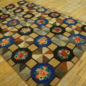 Colorful high-pile rug displays floral medallions and geometric pinwheel patterns on aged wood flooring.