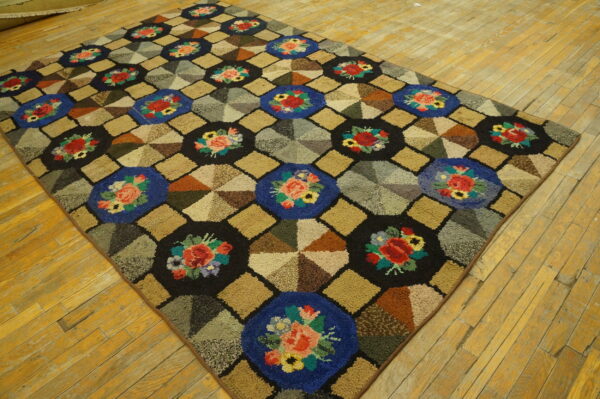 Colorful high-pile rug displays floral medallions and geometric pinwheel patterns on aged wood flooring.