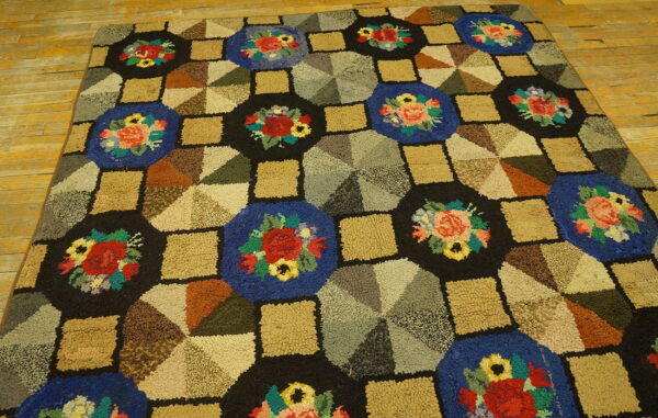 High-pile rug featuring a geometric patchwork of floral blue, black, and earth-toned blocks on wood flooring.