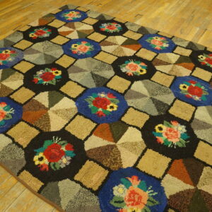 Textured rug with colorful floral and geometric patchwork designs lying on light golden hardwood flooring.
