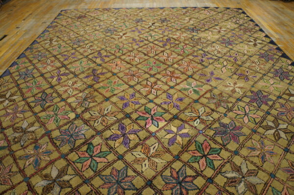 Textured olive rug featuring a multicolor floral pattern inside a dark diamond trellis on wood floor.