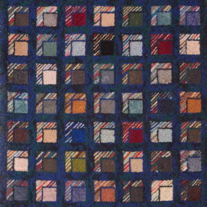 A dark blue hooked rug features a repeating multicolored block pattern resembling log cabin quilt squares.