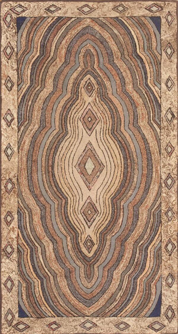 Textured rug displaying abstract, concentric lines in tan, brown, and muted blue, with a bordered diamond motif.