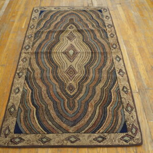 Multicolored, high-texture runner rug with wavy concentric diamond patterns on distressed wood flooring.