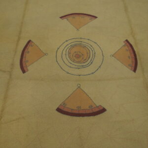 Tan, low-pile rug featuring a geometric cross pattern of numbered orange quadrants and blue concentric target rings.