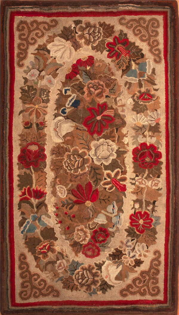 Beige hooked rug featuring a detailed central floral medallion in red, brown, and cream with a striped border.